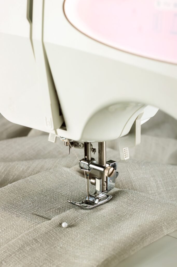 The modern sewing machine and item of clothing. sewing process.