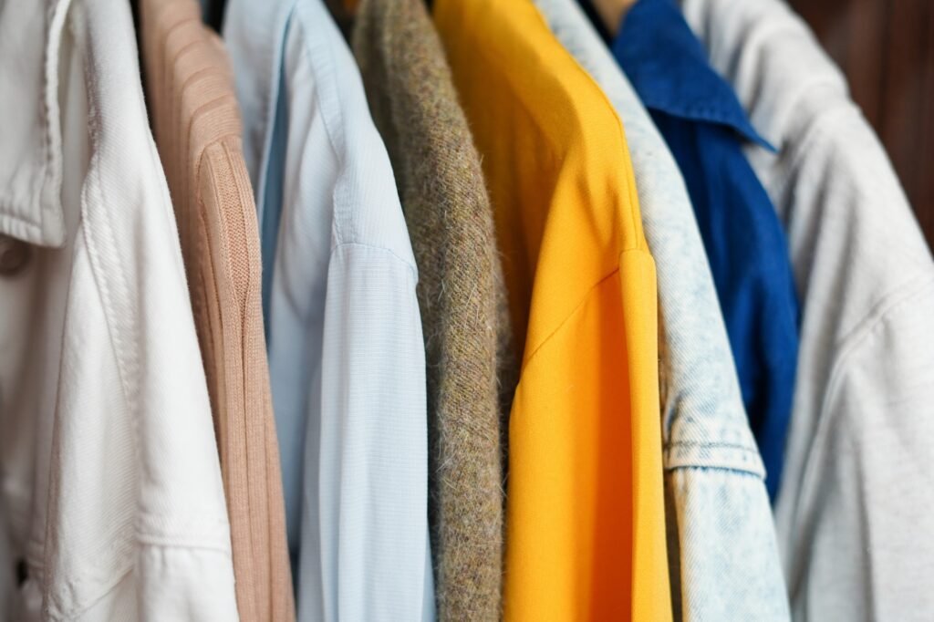 Clothing hanging on a clothing rack in a shop or home closet